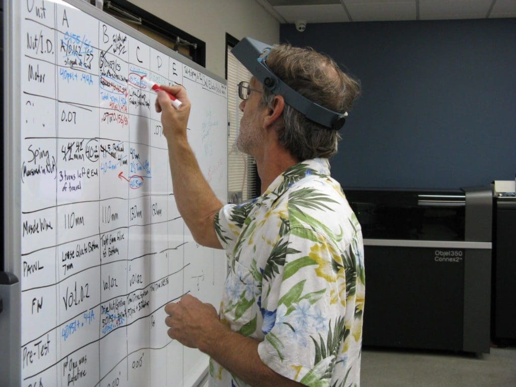 IMG_1532 Engineer editing specifications and values on a whiteboard