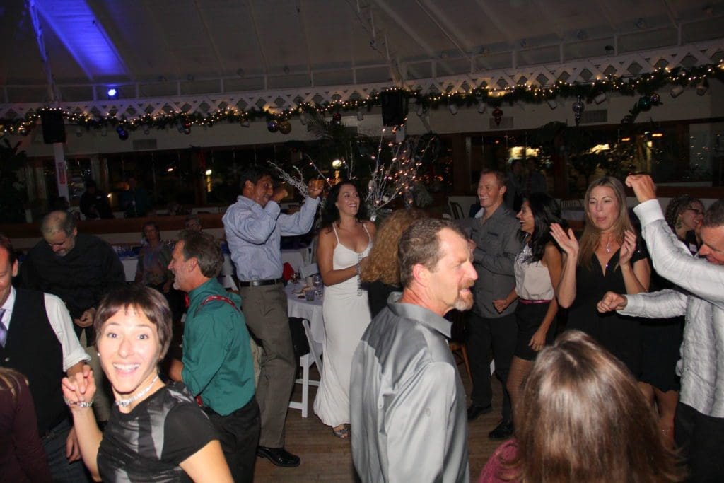 Dan, Rajan, Kevin Bokelman, Jesse Rutherford, and other NOVO team members dancing and having a great time at a holiday party