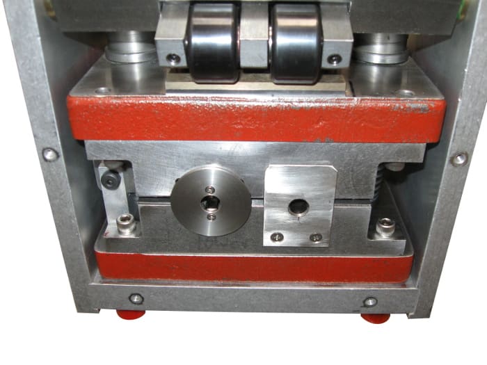 Detailed view of golf club hosel crimper machine