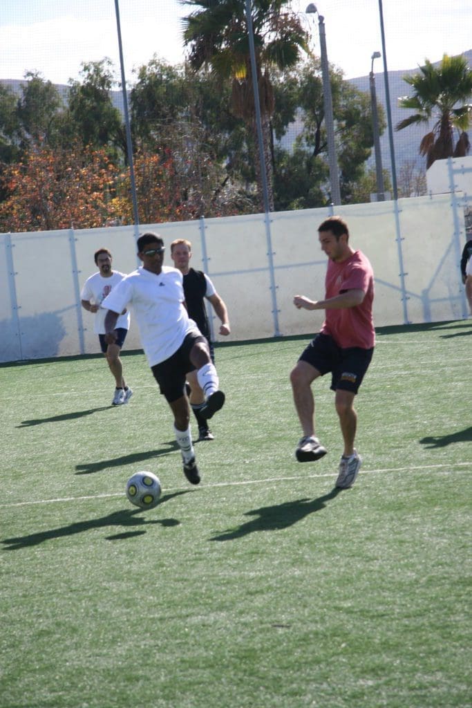 men enjoying a game of soccer